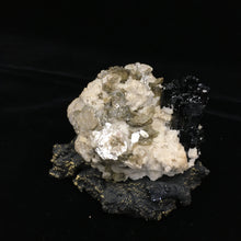 Schorl on Microcline with Muscovite